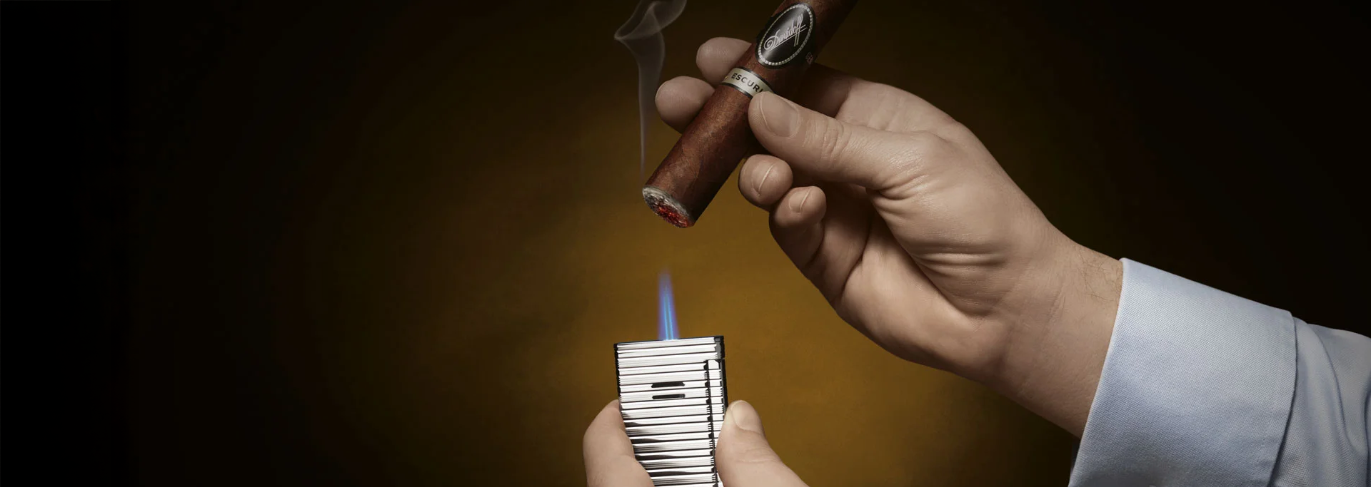 Davidoff cigar being lit with a Davidoff torch lighter