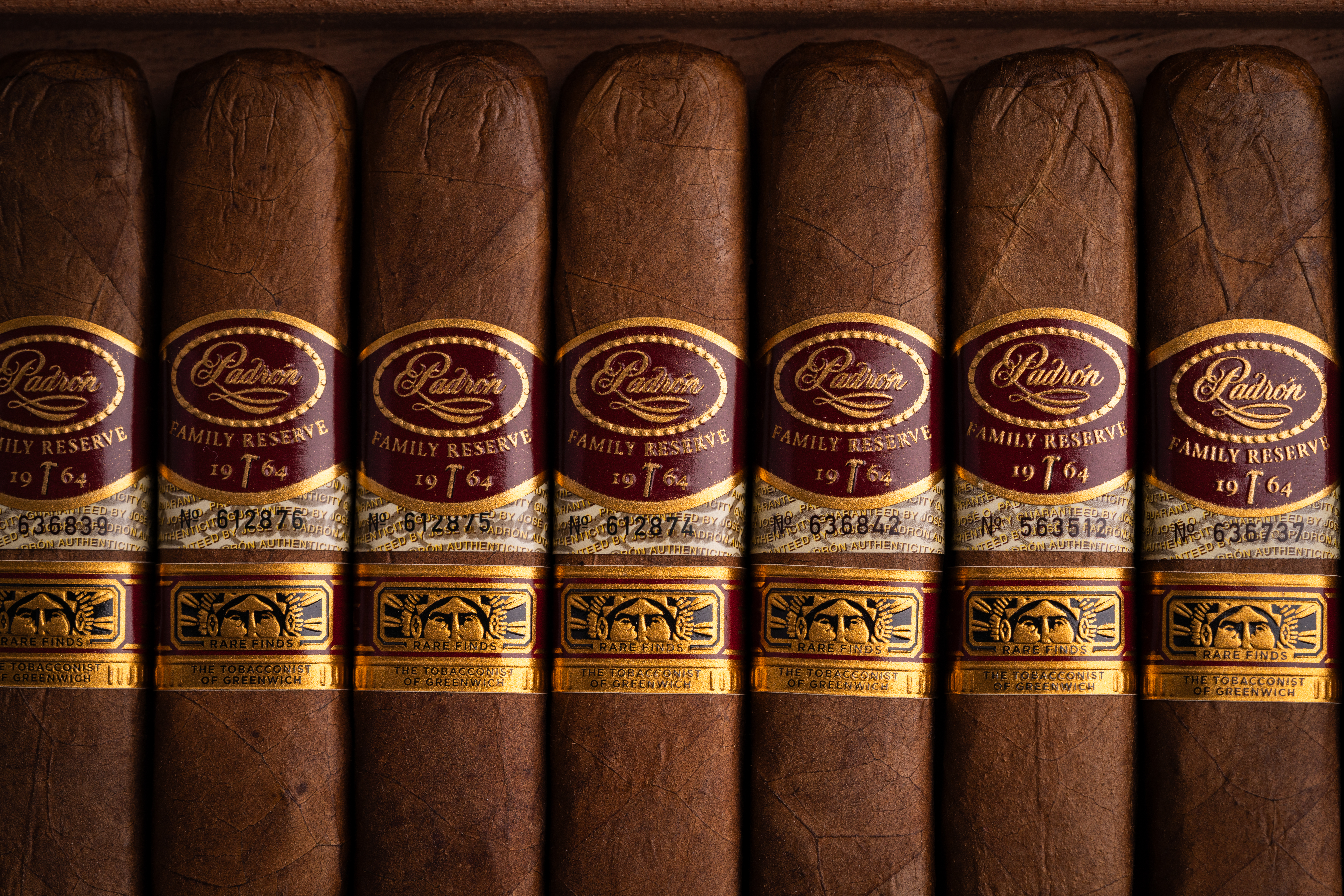 Padron Rare Finds A Hammer & A Dream Natural cigars with gold bands and Tobacconist of Greenwich Logo