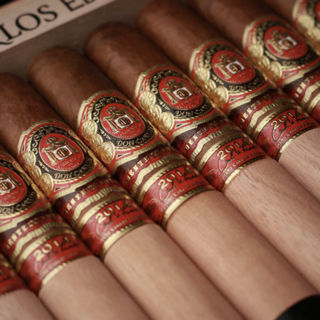 This exclusive bundle features a box of 10 Don Carlos Edicion de Aniversario Robusto cigars, along with two Opus X Forbidden X El Beso Prohibido cigars cover Don Carlos aniversario robusto